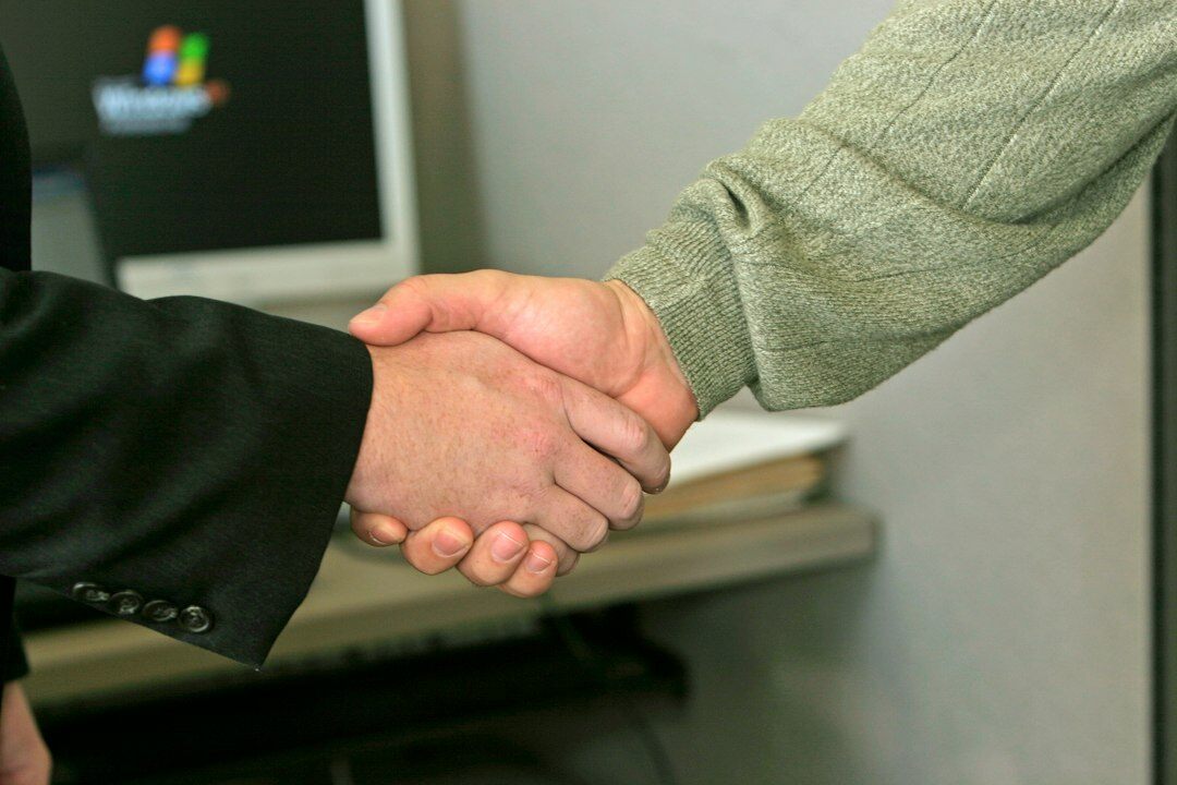 business executives shaking hands