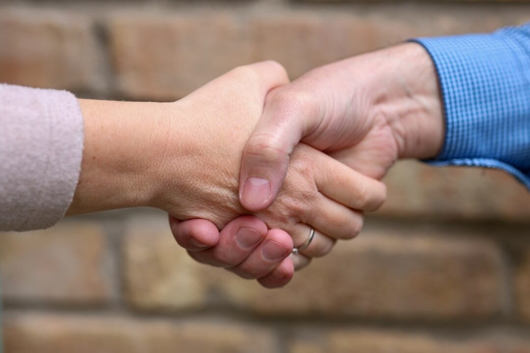 corporate merger handshake